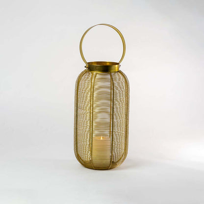 Decorative gold metal mesh lantern with candle holder for modern tabletop decor styling use.