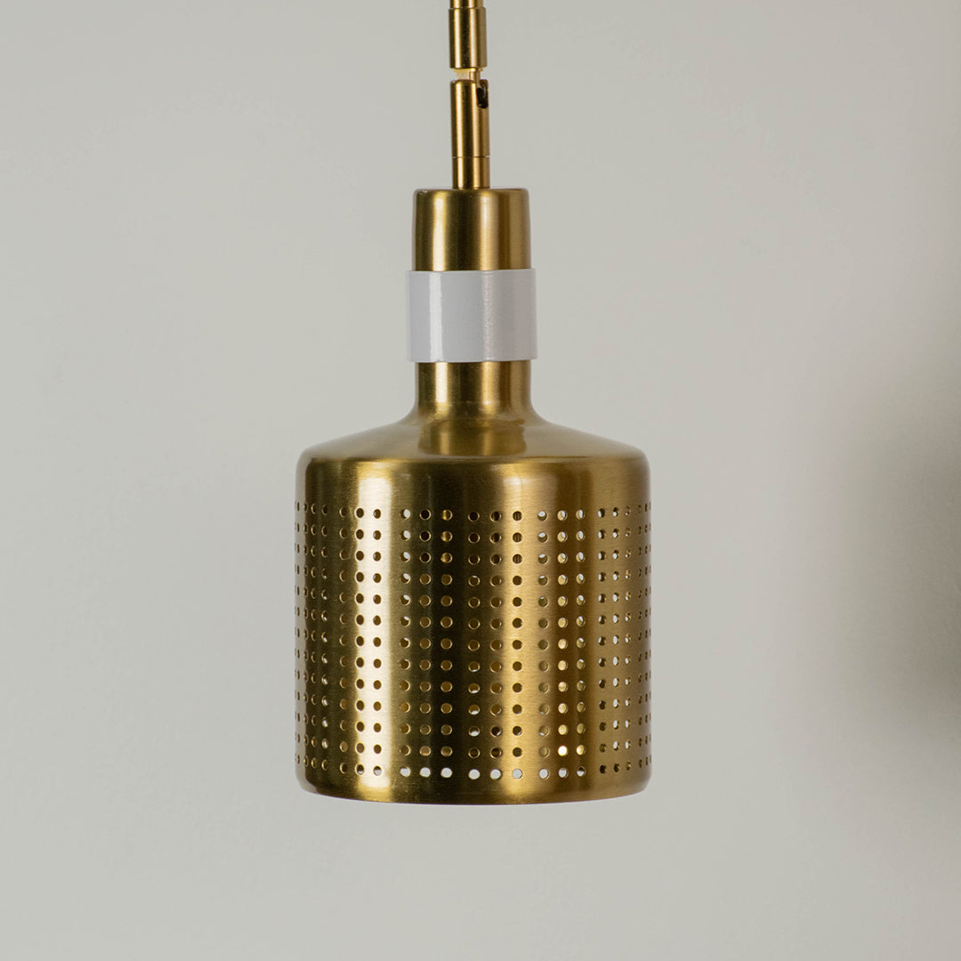Gold perforated metal pendant light with cylindrical shade modern hanging lamp for kitchen dining room stylish decor lighting.