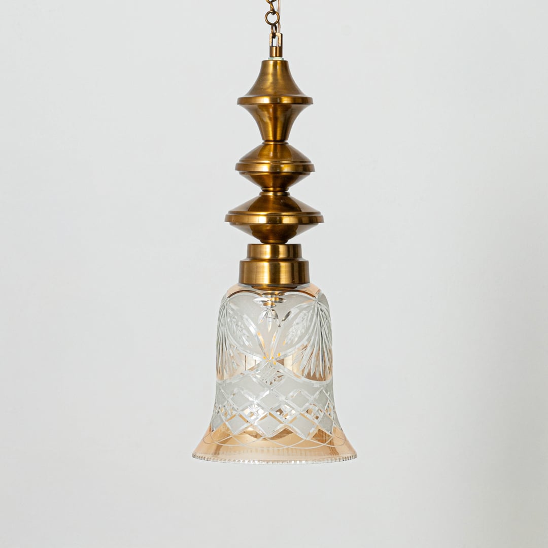 Hanging pendant light with bell-shaped etched glass and brass detailing ideal for elegant traditional interiors.