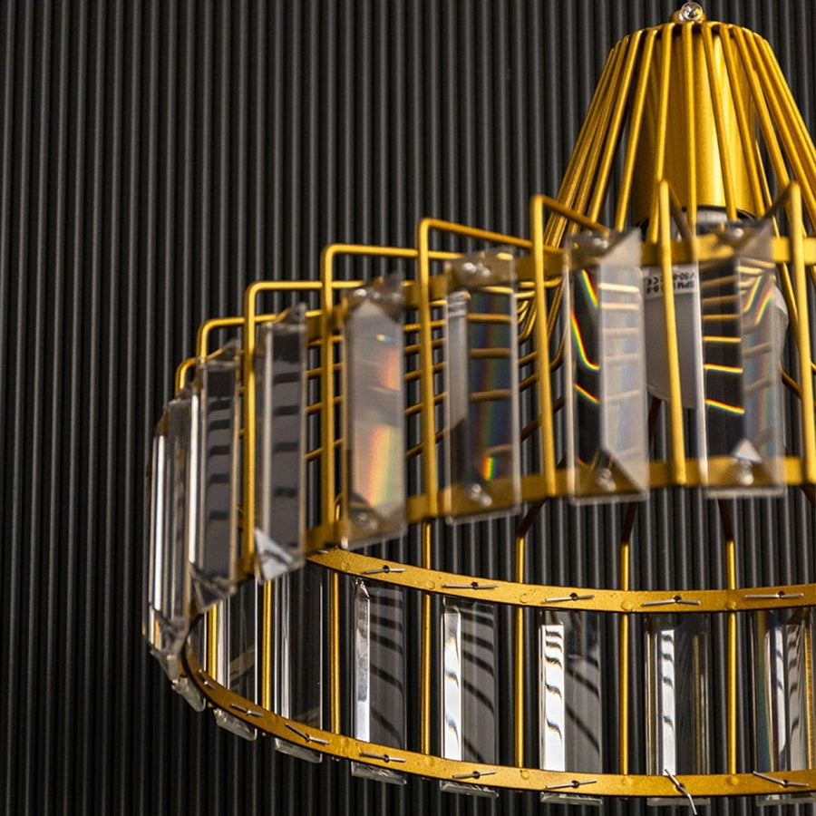 Macro shot of the gold crystal pendant light highlighting the polished golden rods and clear crystal panels revealing the premium finish and detailed construction.