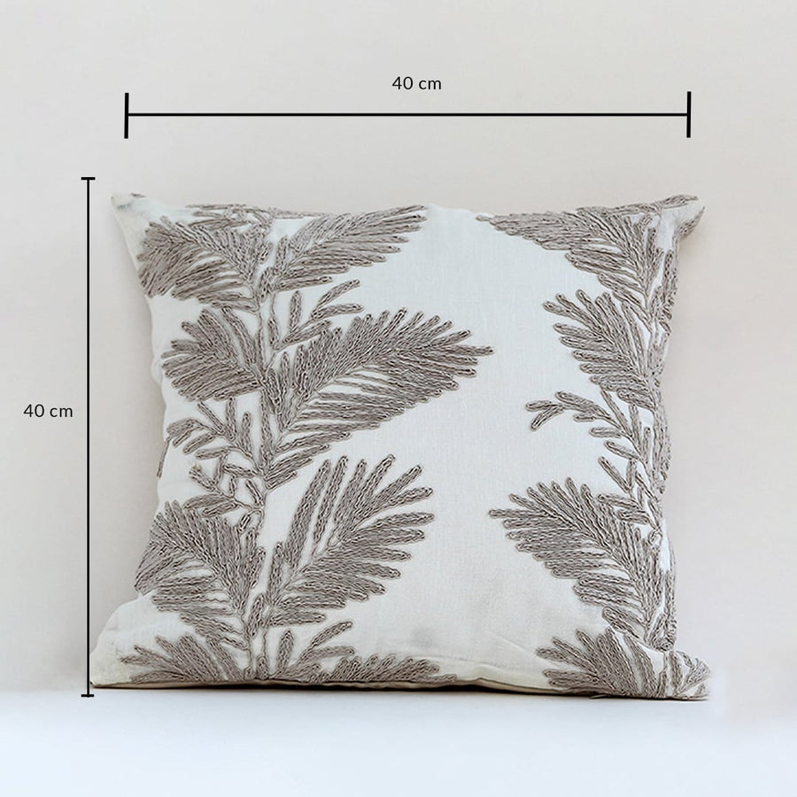 Soft cotton cushion cover with beige botanical embroidery shown with visible dimensions of 40 cm by 40 cm offering an elegant nature inspired décor element with a breathable gentle and skin friendly fabric.