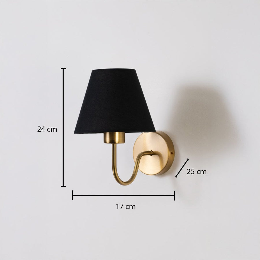 Gold wall sconce with black shade shown with 24 cm height 17 cm width and 25 cm depth for accurate placement.