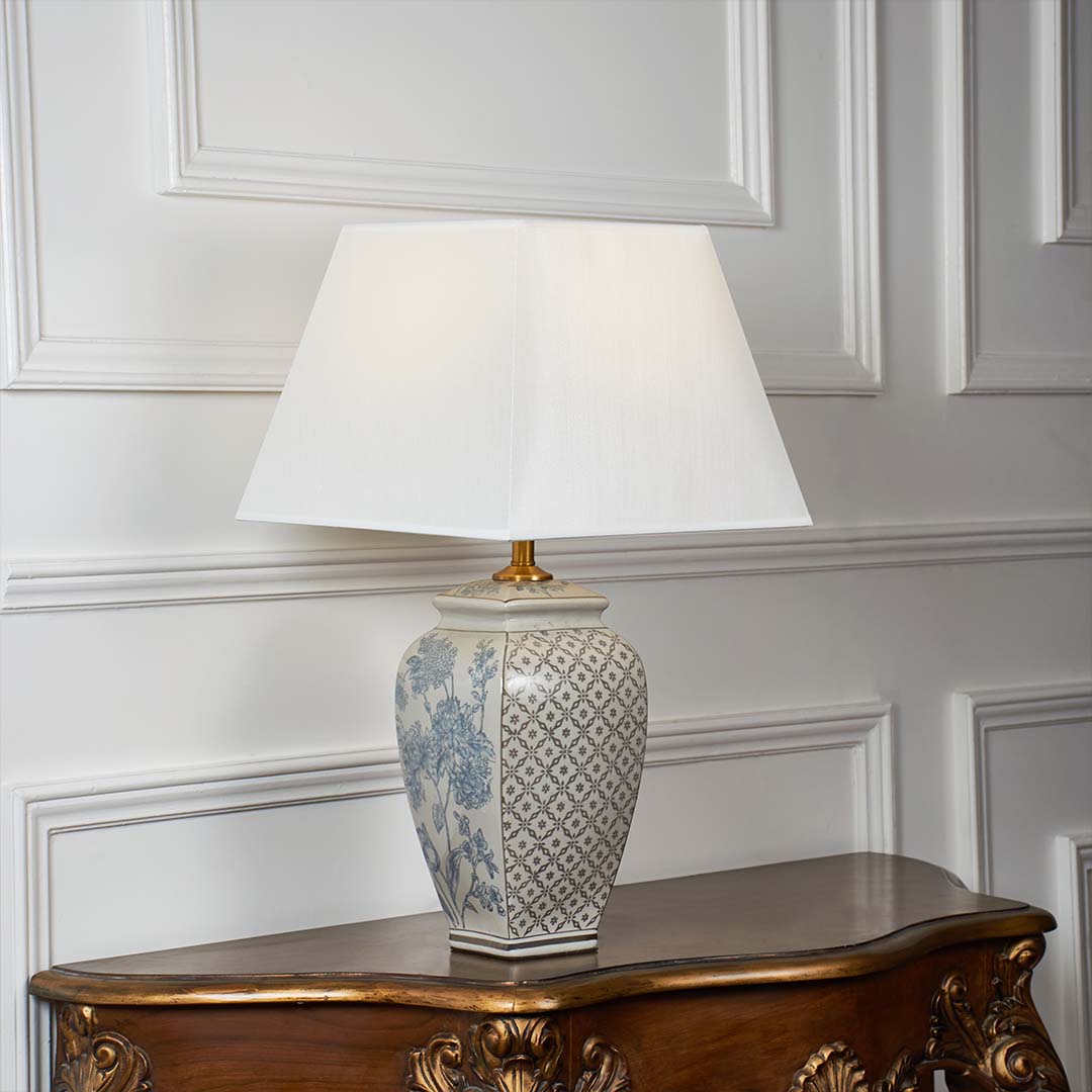 Grey patterned ceramic table lamp with fabric shade designed for elegant traditional decor and ambient table lighting indoors.