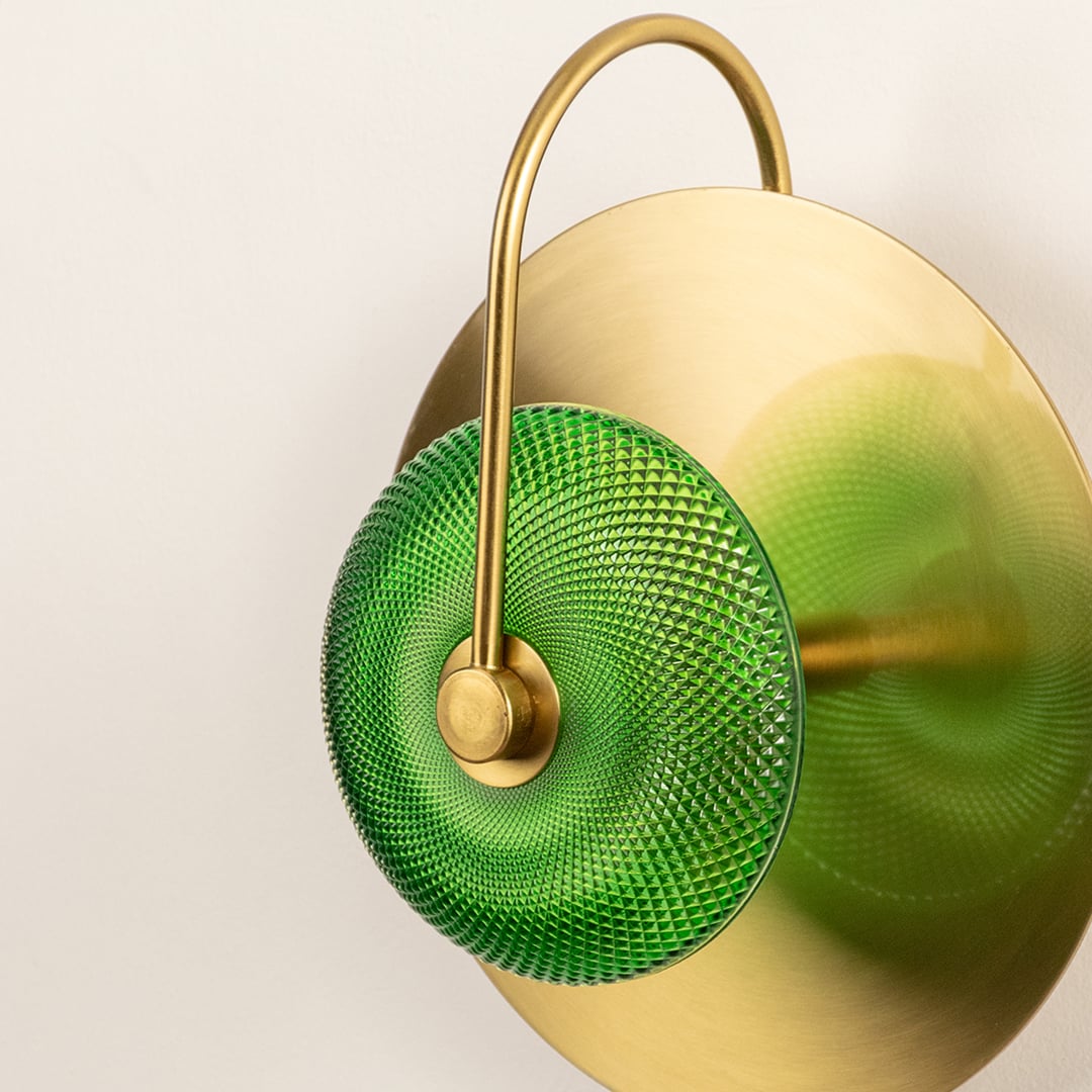Decorative brass wall lamp with round green glass shade perfect for bedroom hallway or living room lighting.