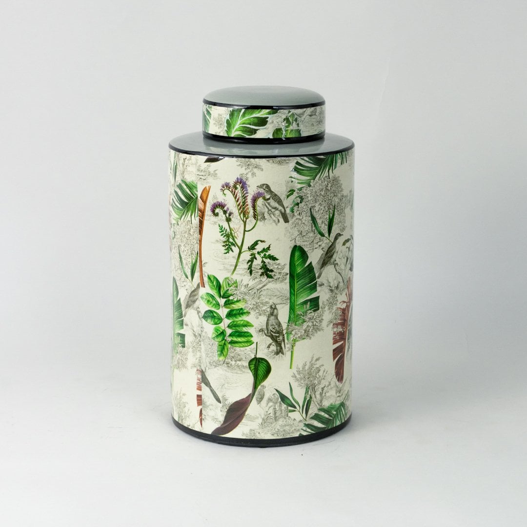 Tropical leaf jar displayed on a white background highlighting its glossy finish and botanical print.