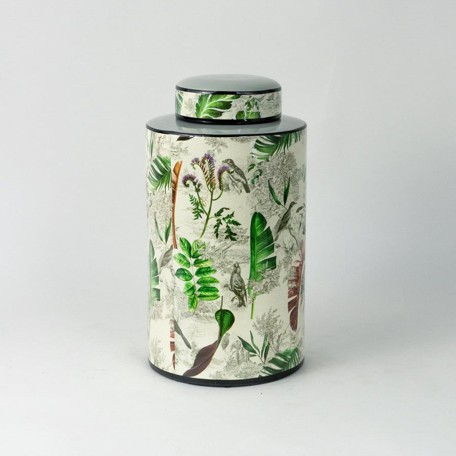 Tropical leaf jar displayed on a white background highlighting its glossy finish and botanical print.