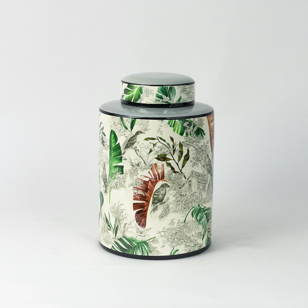 Tropical bird jar displayed on a white background showcasing detailed bird and leaf artwork.