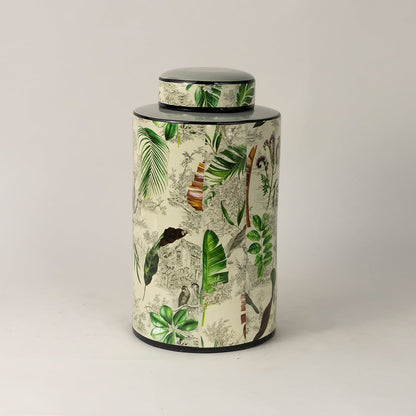 Side angle of Tropical leaf jar showing smooth cylindrical shape glossy finish and tropical foliage design.