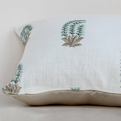 Soft cotton cushion cover with blue and green botanical motifs shown at an angle offering a natural décor accent with a breathable gentle and skin friendly fabric suitable for modern home styling.