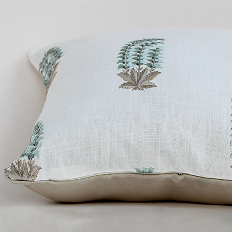 Soft cotton cushion cover with blue and green botanical motifs shown at an angle offering a natural décor accent with a breathable gentle and skin friendly fabric suitable for modern home styling.
