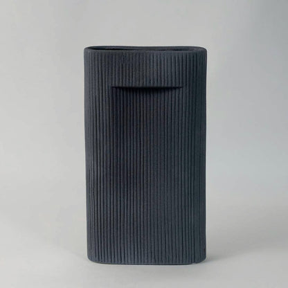 Elegant tall ceramic vase in matte black finish with vertical ribbed design perfect for living room and office decoration.