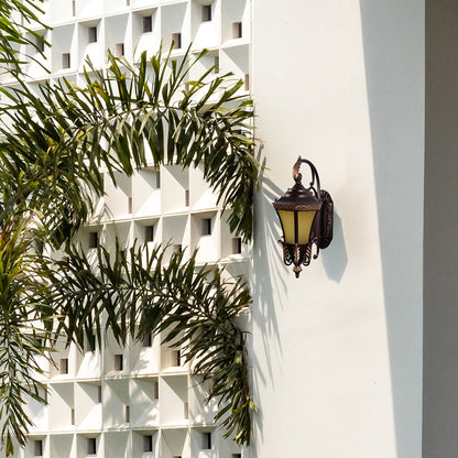Stylish outdoor wall light with vintage lantern design adding warm glow to exterior walls of modern and classic homes.