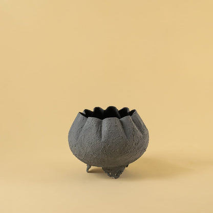 Grey metal scalloped bowl planter decor on a clean white background highlighting its textured elegant finish for home styling.