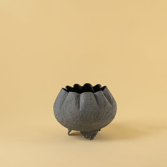 Grey metal scalloped bowl planter decor on a clean white background highlighting its textured elegant finish for home styling.