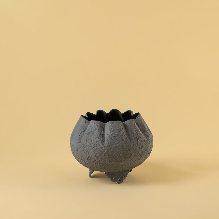 Grey metal scalloped bowl planter decor on a clean white background highlighting its textured elegant finish for home styling.