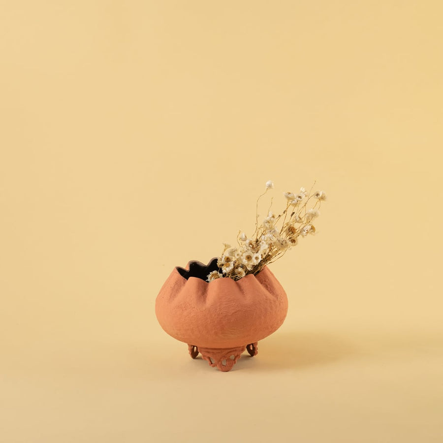 Terracotta metal scalloped bowl planter decor styled in a warm modern room adding an earthy elegant accent to living room tables.