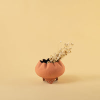 Terracotta metal scalloped bowl planter decor styled in a warm modern room adding an earthy elegant accent to living room tables.