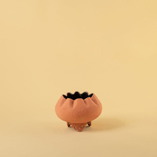 Terracotta metal scalloped bowl planter decor on a clean white background highlighting its textured warm finish for home styling.