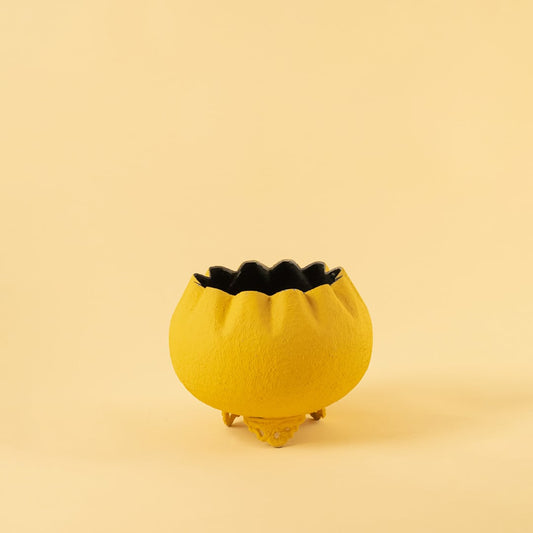 Yellow metal scalloped bowl planter decor on a clean white background highlighting its textured bold finish for home styling.
