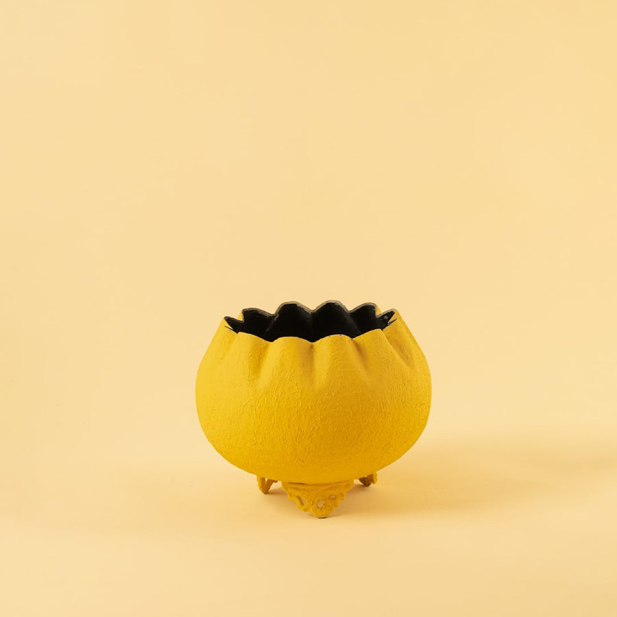 Yellow metal scalloped bowl planter decor on a clean white background highlighting its textured bold finish for home styling.