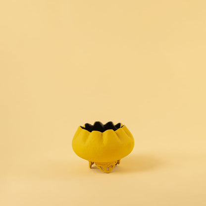 Yellow metal scalloped bowl planter decor on a clean white background highlighting its bold textured finish for home styling.