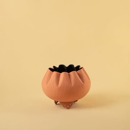 Terracotta metal scalloped bowl planter decor on a clean white background highlighting its textured warm finish for home styling.