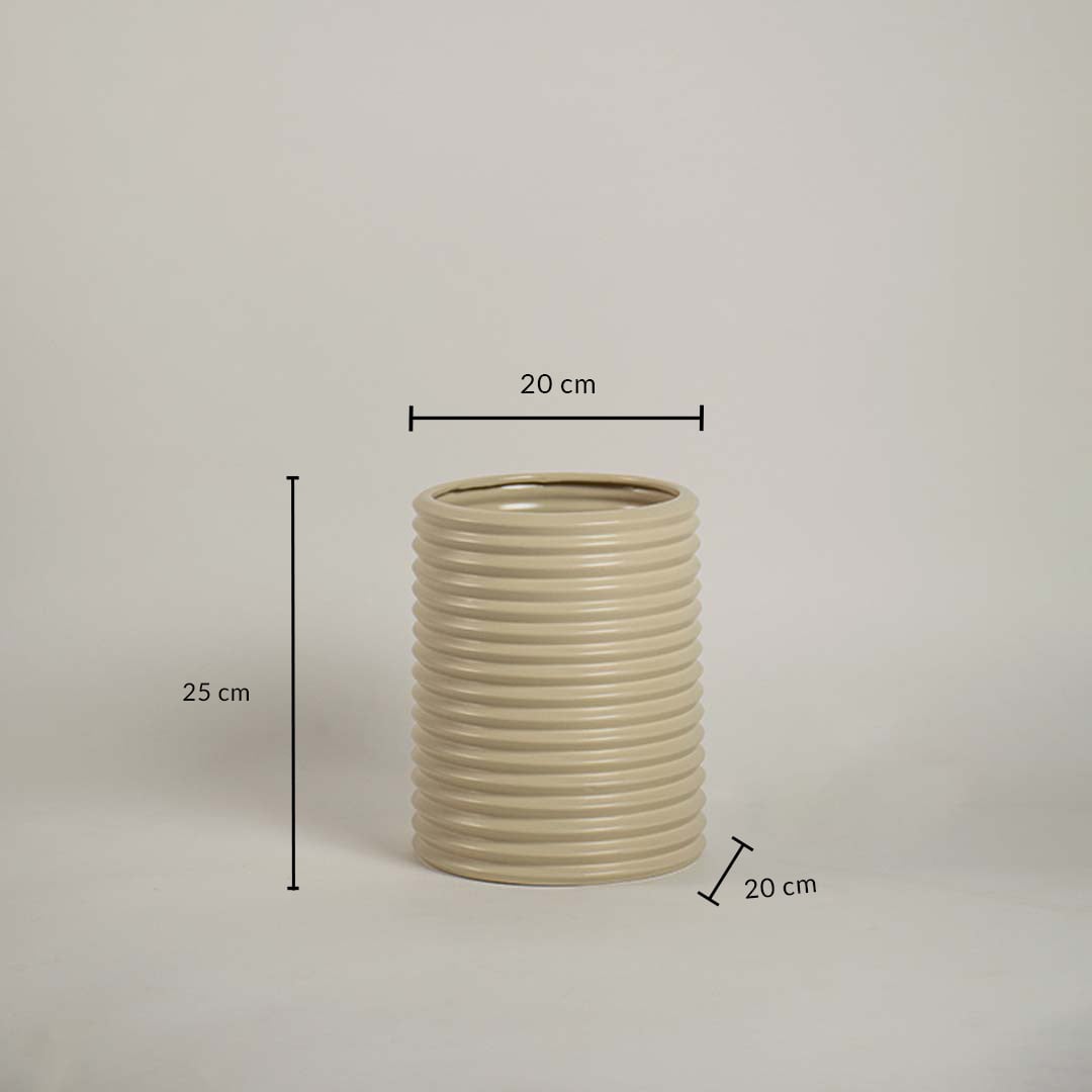 Beige ribbed ceramic vase measuring 25 cm height and 20 cm width shown on white background for size reference.