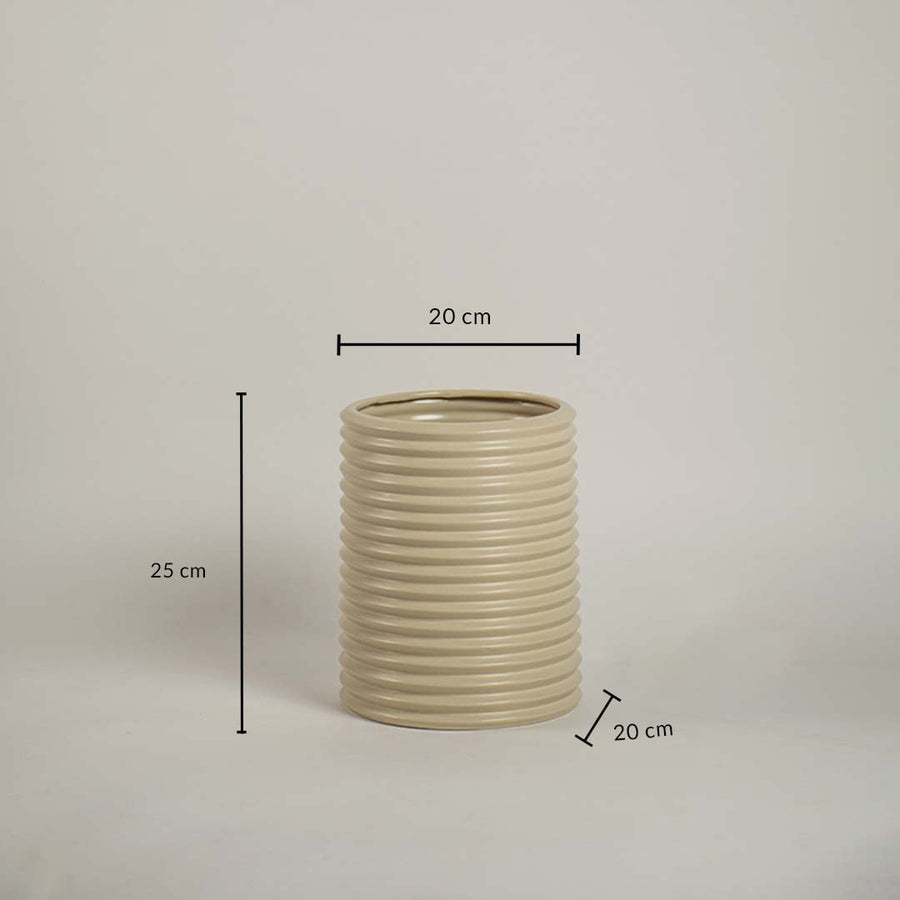 Beige ribbed ceramic vase measuring 25 cm height and 20 cm width shown on white background for size reference.