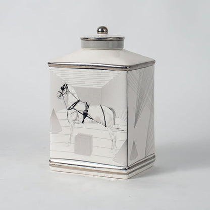 White ceramic jar with crane artwork shown on simple background for elegant luxury home décor styling.