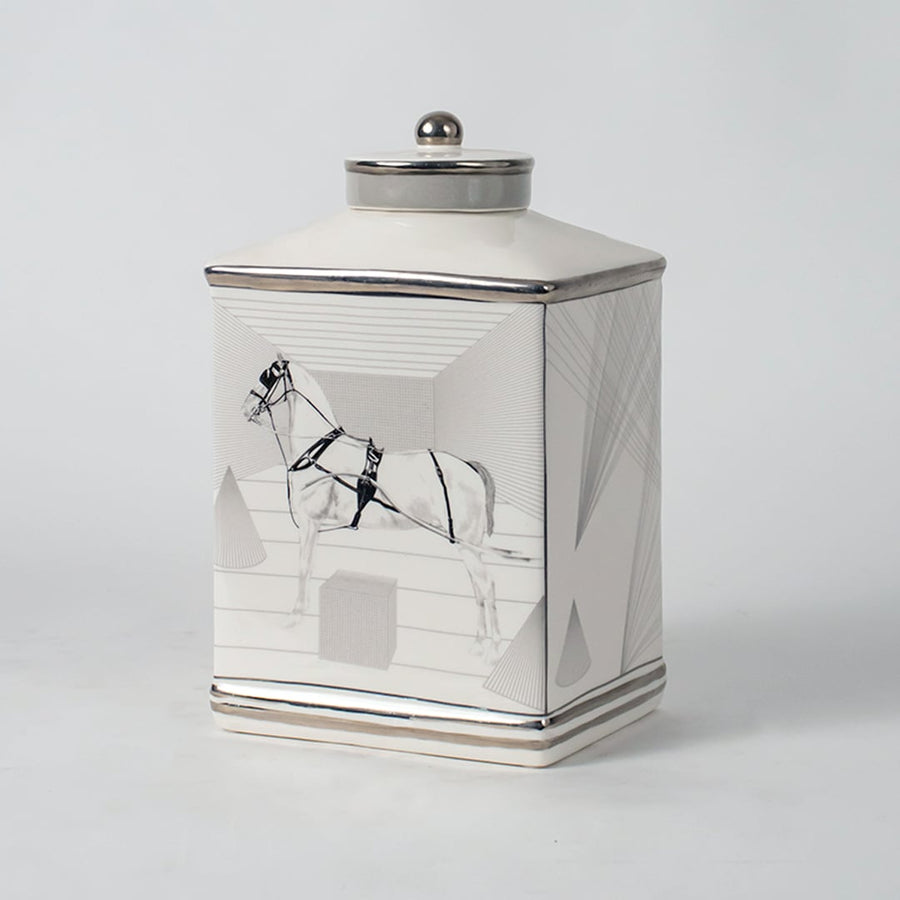 White ceramic jar with crane artwork shown on simple background for elegant luxury home décor styling.