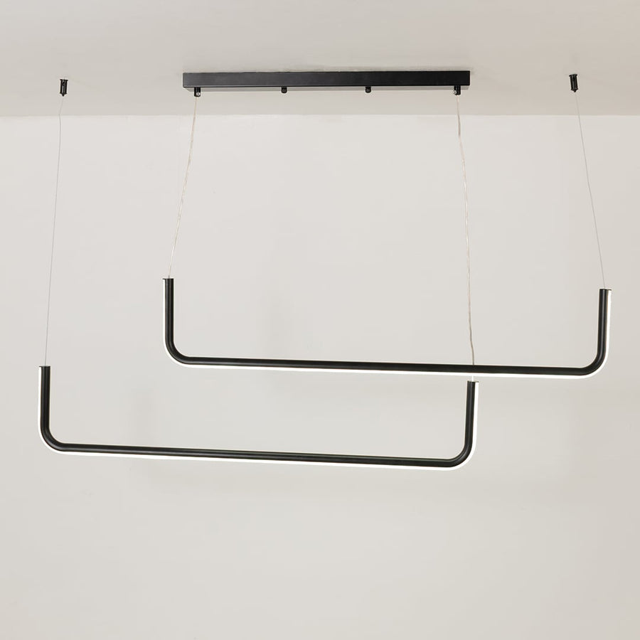 Modern black hanging light glowing softly on a bright white background showing a sleek dual bar design for stylish interiors.