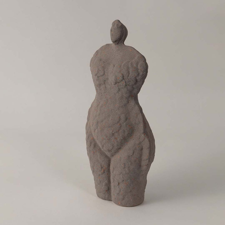 Side angle view of grey ceramic torso sculpture vase with unique handcrafted texture styled for modern home and office decor.