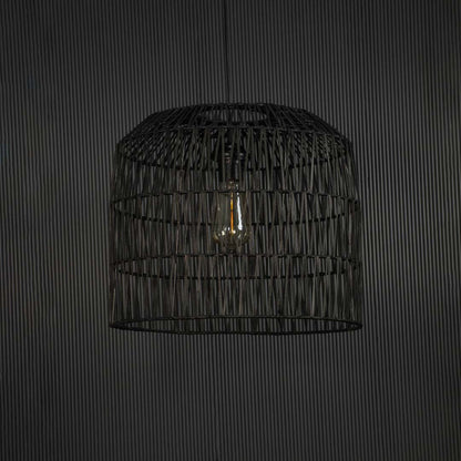 Elegant black woven wire pendant light against dark background featuring minimalist handwoven design and sleek artistic texture.