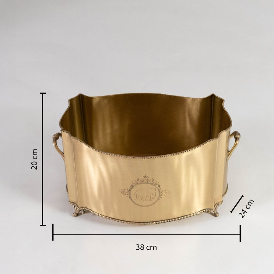 A gold metal storage basket with curved edges and side handles shown on a white background with dimensions 38 cm width 24 cm depth and 20 cm height clearly displayed.