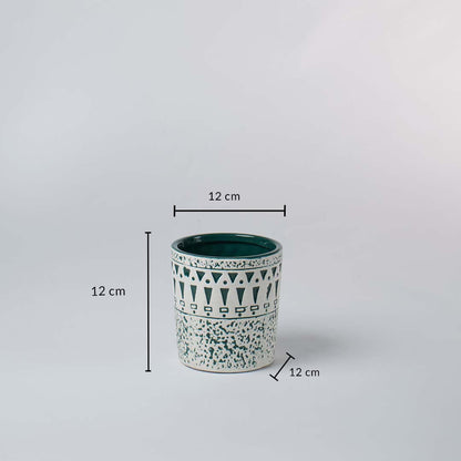 White and teal ceramic planter shown with 12 cm height and 12 cm width offering a clear accurate size reference.