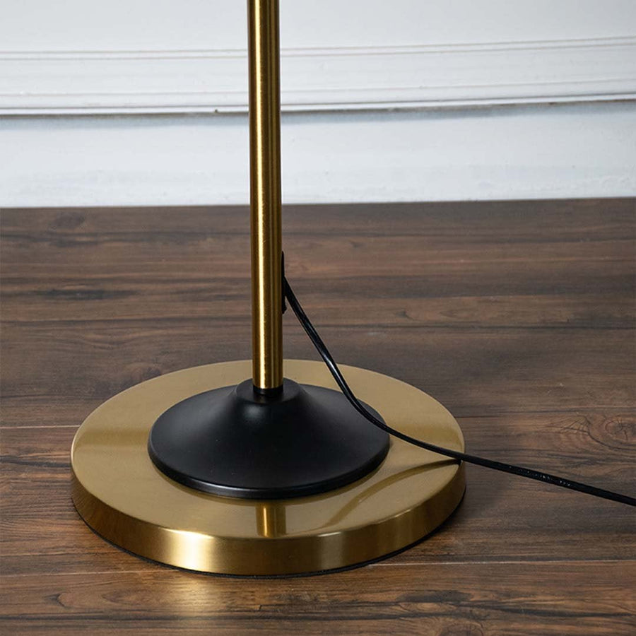 Refined closeup of the lamp black matte cone shade with golden neck designed for ambient task lighting.