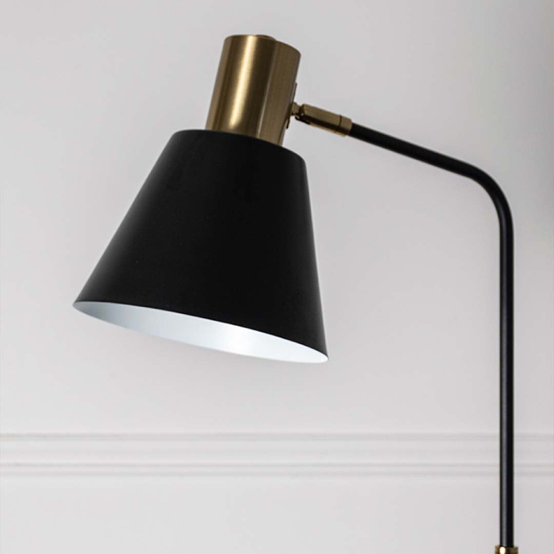 Closeup view of the black lampshade with gold detailing showcasing craftsmanship and elegant design.
