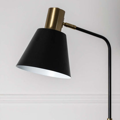 Closeup view of the black lampshade with gold detailing showcasing craftsmanship and elegant design.