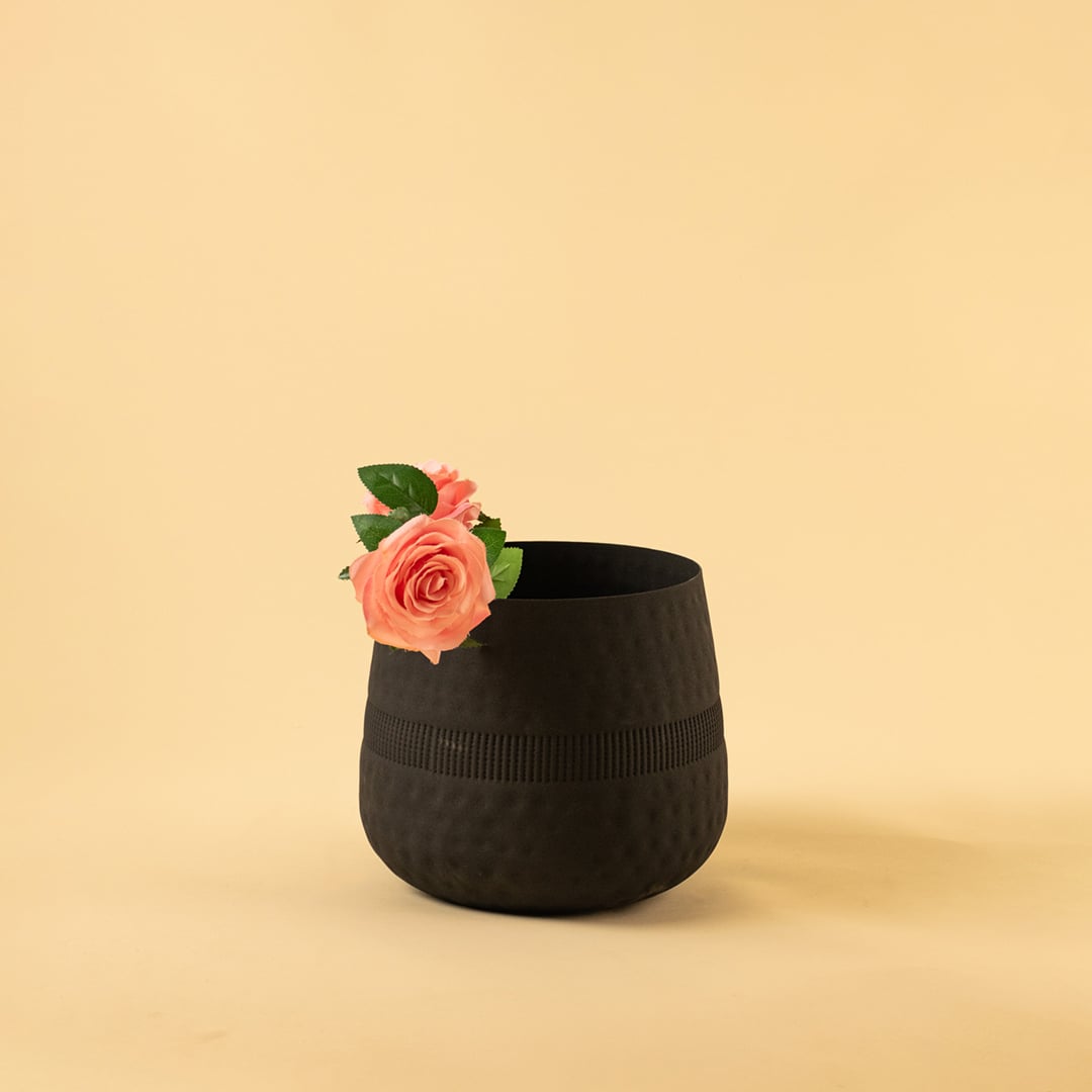 Black textured pot with matte finish styled in a modern home setting adding bold minimal decor to shelves and tabletops.