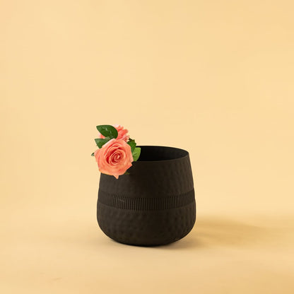 Black textured pot with matte finish styled in a modern home setting adding bold minimal decor to shelves and tabletops.