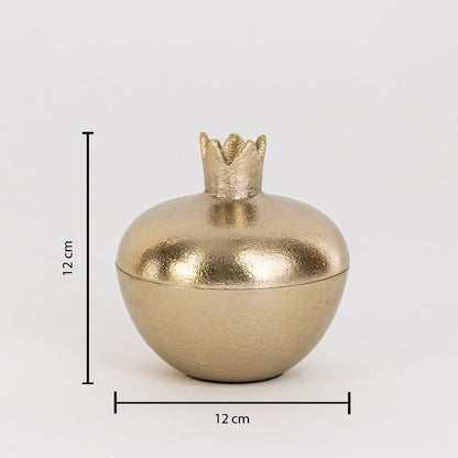 Gold metal pomegranate jar measuring 12 cm tall and 12 cm wide with crown lid and glossy finish shown on white wall