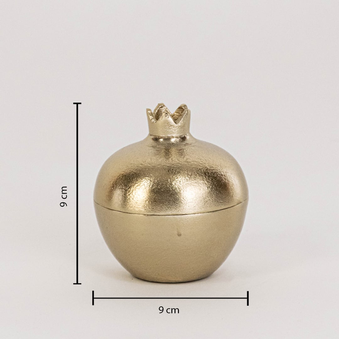 Small gold metal pomegranate jar measuring 9 cm tall and 9 cm wide shown with crown top on white background wall