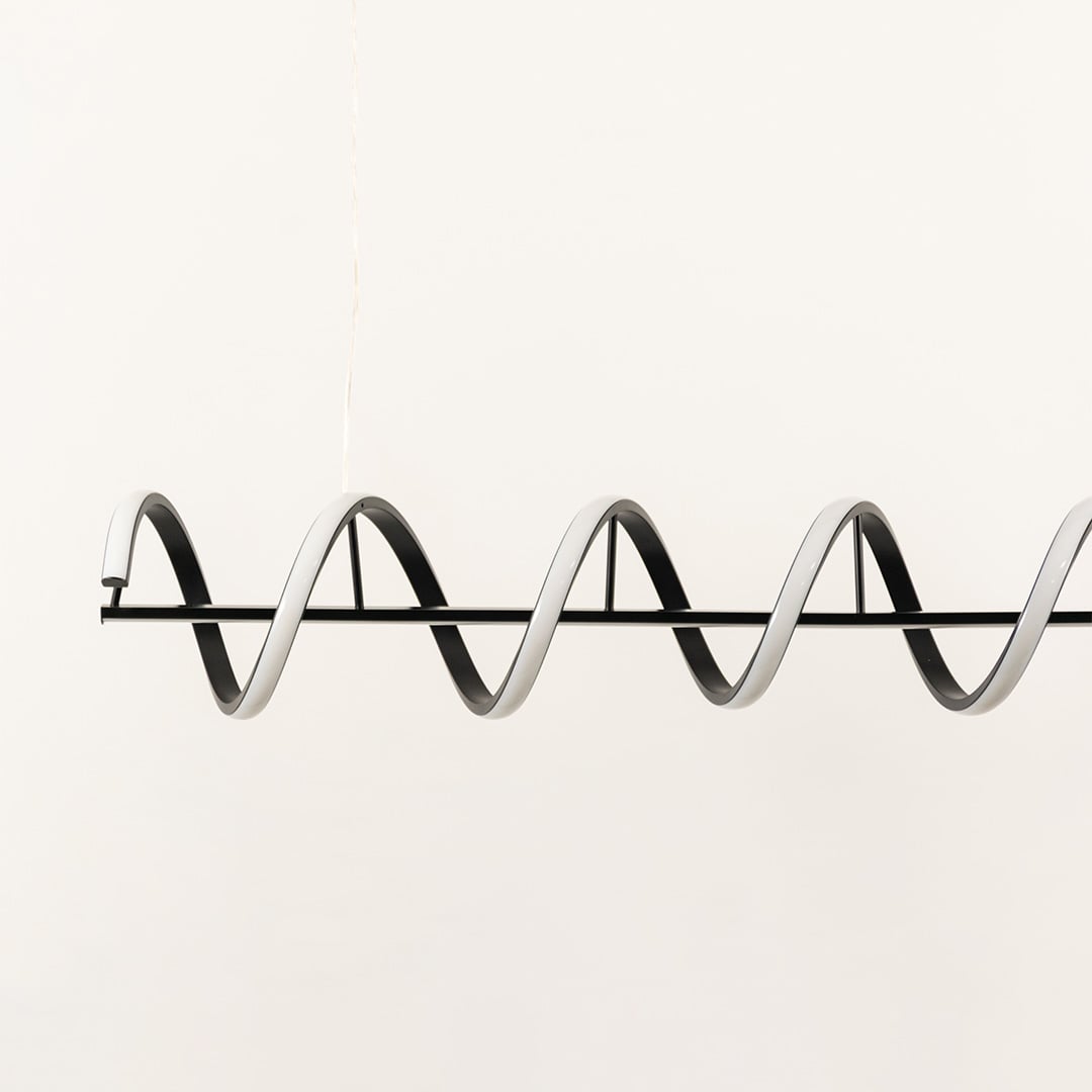 Black metal wave LED pendant light showcasing sleek geometric curves and premium modern lighting craftsmanship.