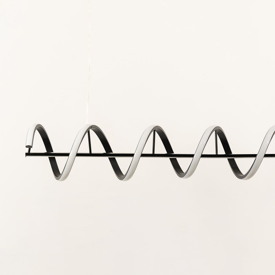 Black metal wave LED pendant light showcasing sleek geometric curves and premium modern lighting craftsmanship.