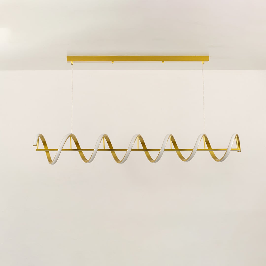 Gold linear wave chandelier in a front view against a white background with lights on perfect for stylish modern lighting décor.