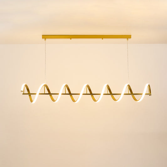 Gold metal wave LED pendant light with integrated illumination creating elegant modern ambient ceiling lighting indoors.