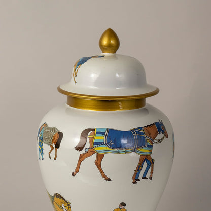 Detailed closeup of white ceramic jar showing intricate horse artwork with gold rim and glossy decorative finish.