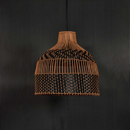 Two-tone rattan pendant light on dark background highlighting intricate weaving and smooth dome silhouette.