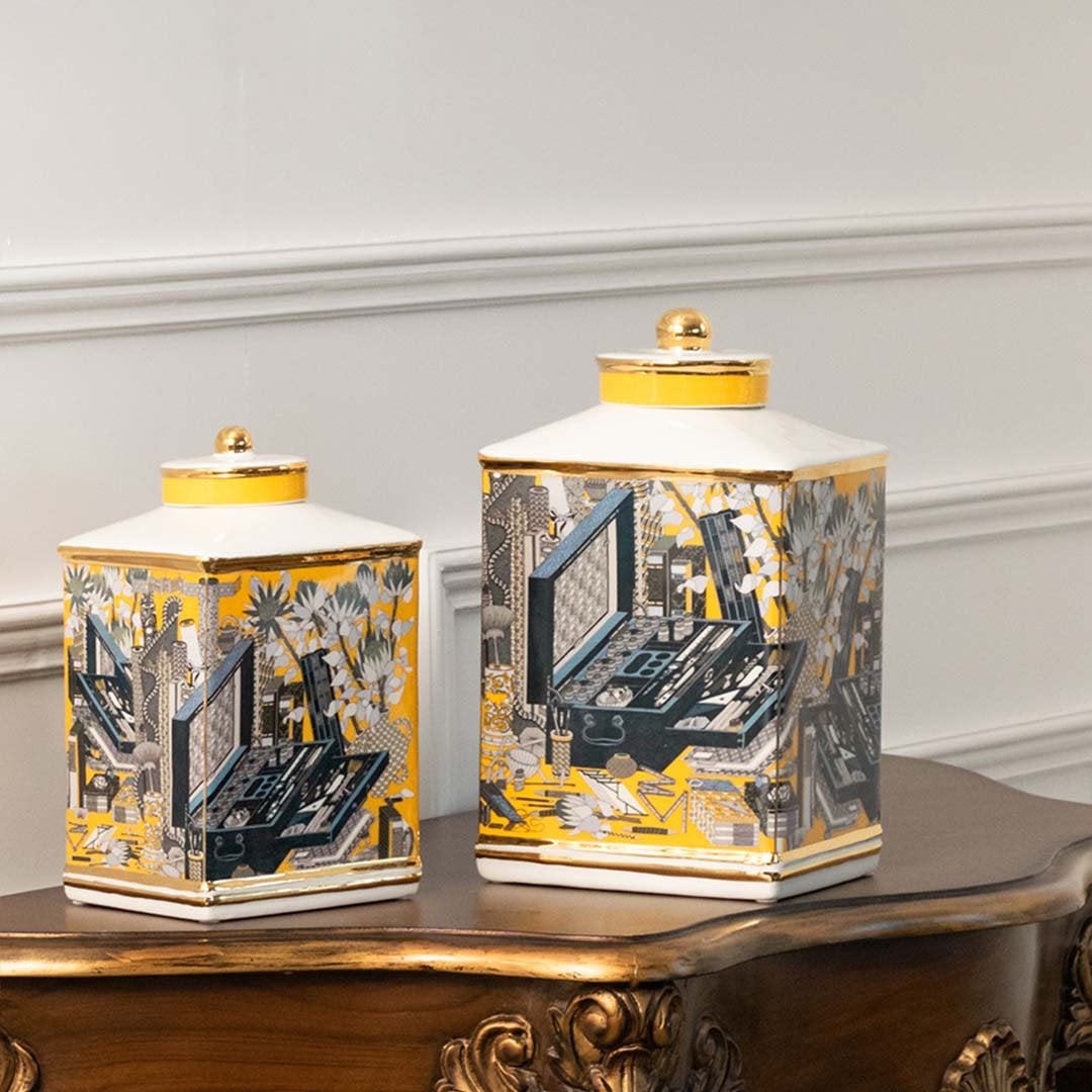 Yellow and blue ceramic jars with horse artwork perfect for luxury living room décor and stylish console arrangements.
