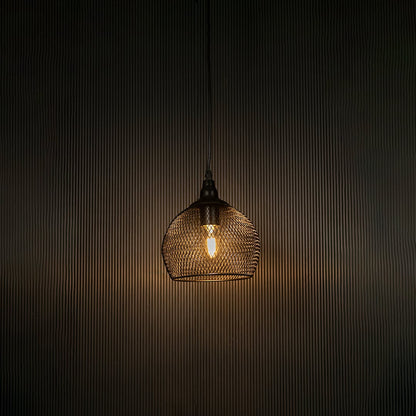 Black mesh pendant light illuminated beautifully against dark background highlighting sleek craftsmanship.